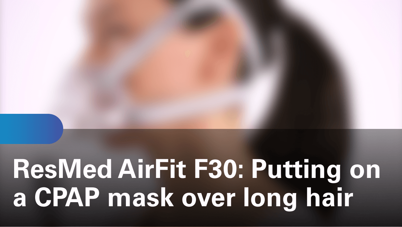 sleep-apnea-airfit-f30-putting-on-a-cpap-mask-over-long-hair